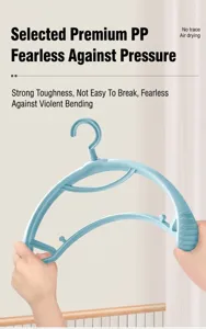 Close-up of the flexible blue plastic clothes hanger showing durability and toughness.