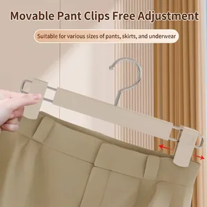 Adjustable non-slip clothes hanger with sliding clips for pants and skirts.