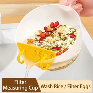 Multifunctional filtering measuring cup for rice washing and egg beating