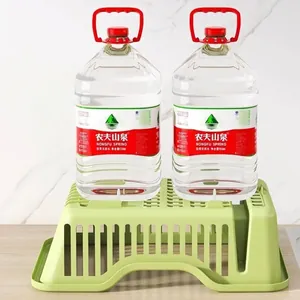 Sturdy green plastic dish drying rack for kitchen countertop storage and organization.