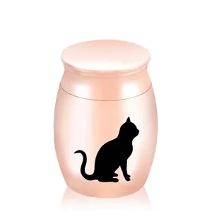 Detail view of a rose gold pet cremation urn featuring a black cat silhouette for cat ashes