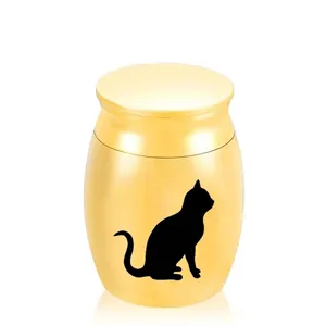 Detailed view of a gold pet memorial urn featuring a black cat silhouette for hair.