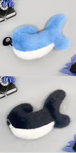 Detailed view of plush blue and black shark tails for furry and kigurumi cosplay costumes