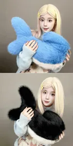 Close-up detail of large plush shark tail props in blue and black faux fur for cosplay