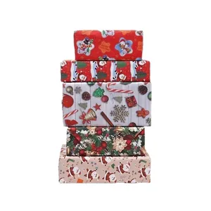 Rollos de papel de regalo de Navidad vintage con motivos de Papá Noel y muñecos nieve