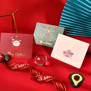 Collection of premium gold foil Christmas cards with festive illustrations in a themed scene