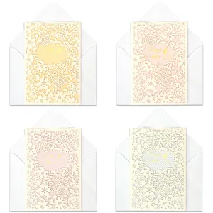 Elegant French laser-cut floral wedding invitations with white envelopes in pastel colors