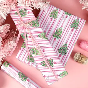 Festive pink striped Christmas wrapping paper with watercolor Christmas tree patterns