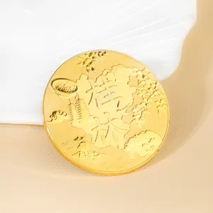 Detailed macro shot of a gold Guilin souvenir coin featuring famous landmark engravings