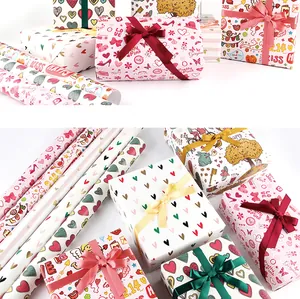 Detailed view of various Valentine's Day wrapping paper rolls and wrapped gift boxes