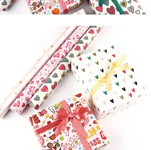 Detailed view of creative Valentine's Day gift wrapping paper with heart and angel motifs