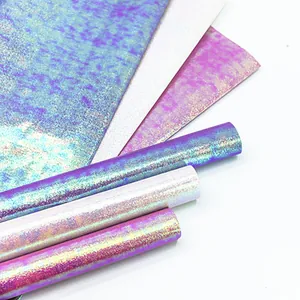 Iridescent glitter gift wrapping paper rolls for Valentine's Day and craft projects.