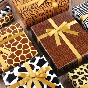 Cadeaudozen verpakt in diverse dierenprint inpakpapieren zoals tijger, koe en luipaard