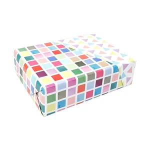 Double-sided gift wrapping paper with colorful geometric square and triangle patterns