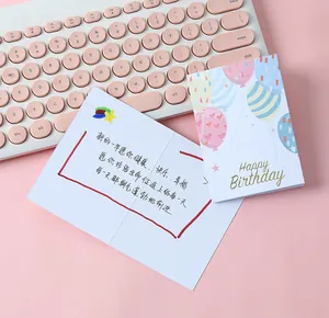 Detailed view of a cute folded birthday card featuring a handwritten inner message