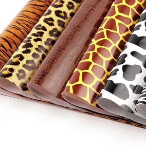 Cadeaupapirollen met dierenprint zoals luipaard, slang, koe en tijger voor DIY-cadeaus