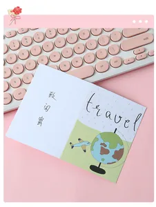 Close-up detail of a cute folding greeting card featuring a travel-themed globe design