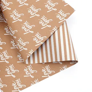 Detail view of double-sided wrapping paper with 'love you' text and stripe pattern