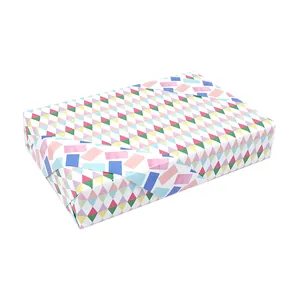 Colorful geometric pattern gift wrapping paper wrapped on a rectangular box for DIY.