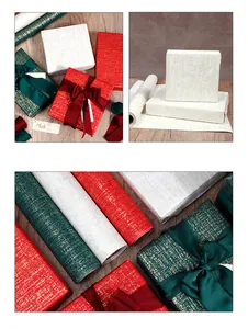 Detail of luxury textured gift wrapping paper rolls in red, green and cream colors