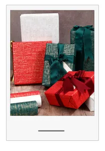 Luxurious textured gift wrapping paper with metallic flecks and elegant silk ribbons