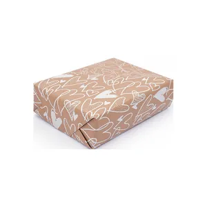 Kraft brown gift wrapping paper with white heart patterns for romantic Valentine's Day.