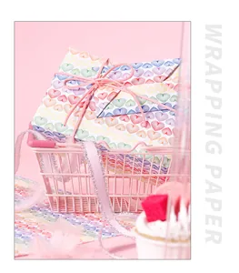 Rainbow heart pattern wrapping paper detail inside a cute pink gift basket display