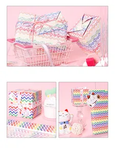 Detail view of creative gift wrapping paper with rainbow stripes and heart patterns.