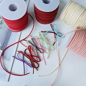 Macro shot of multi-colored faux suede cords for gift wrapping and floral arrangements.
