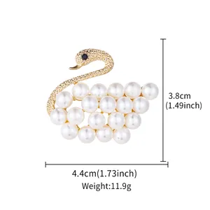 Macro view showing dimensions and weight of elegant gold pearl swan brooch pin