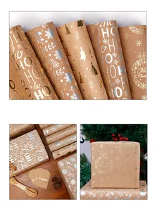 Dettaglio dei motivi stampati in oro e argento su carta da regalo Kraft per il Natale