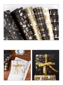 Colección de rollos de papel de regalo de Navidad con renos y copos dorados