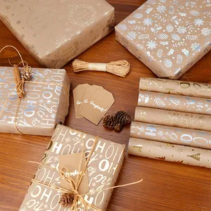 Rotoli di carta da regalo natalizia in kraft vintage con bellissimi motivi in oro