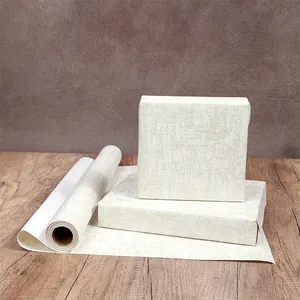 Papier cadeau élégant à texture marbrée crème pour un emballage de luxe de cadeaux