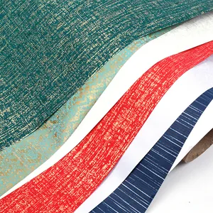 Close-up detail of luxury specialty gift wrapping paper with metallic textures and colors