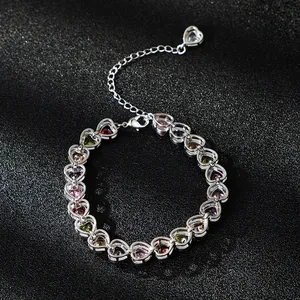Elegant silver bracelet with colorful heart-shaped zircons and extension chain.
