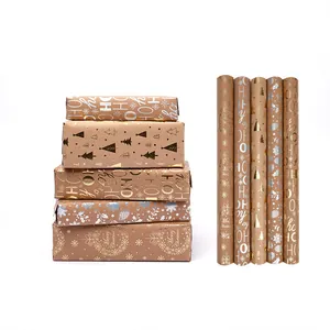 Carta da regalo natalizia in kraft con lamina d'oro e scatole regalo confezionate premium
