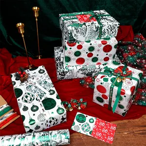 Festive Christmas gift wrapping paper set featuring decorative ribbons and gold foil tags