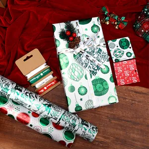 Premium large roll Christmas gift wrapping paper set with metallic foil patterns and ribbons