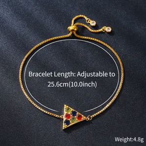 Macro detail of adjustable gold copper bracelet with colorful zircon triangle charm