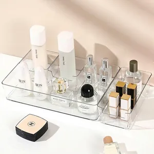 Clear acrylic makeup organizer with multiple compartments for vanity drawer storage