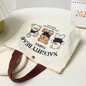 Small canvas tote bag with three cute bears print and brown handles for daily use