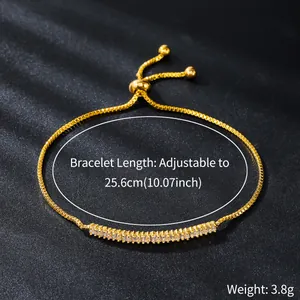 Close-up of elegant adjustable gold bracelet with sparkling zircon stones and weight.