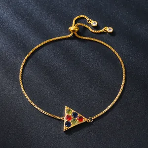Adjustable gold copper bracelet featuring a triangular pendant set with multicolor zircons