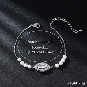 Detailed view of adjustable silver bracelet with marquise-cut stone and white pearls