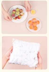 Macro view of disposable elastic food covers being used on fruit plates and bulk pack.