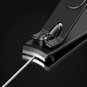 Professional black stainless steel nail clipper cutting wire to show sharpness