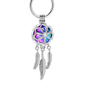 Porte-clés diffuseur d'aromathérapie avec plumes et boule colorée