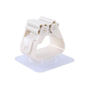 Wall-mounted mop and broom holder clip with strong self-adhesive backing for bathroom organization