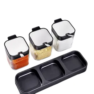 3-piece glass seasoning jar set with black storage tray for salt and spice organization